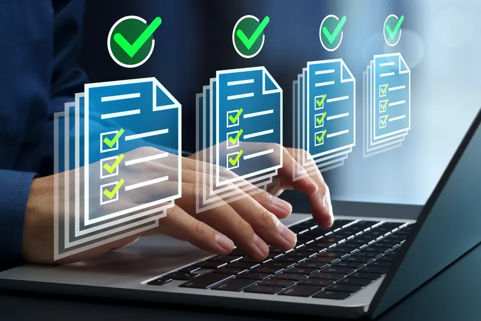 Businessman using laptop computer for regulatory compliance checks