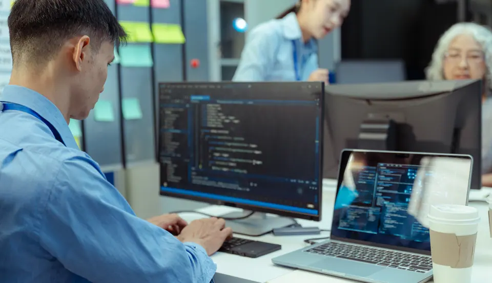 Programmers brainstorming secure data storage and network systems working in website a software and coding technology