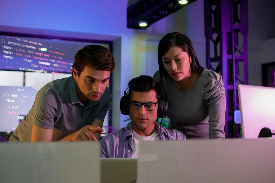 Programming engineers between the ages of 20-30 are developing code on their computers