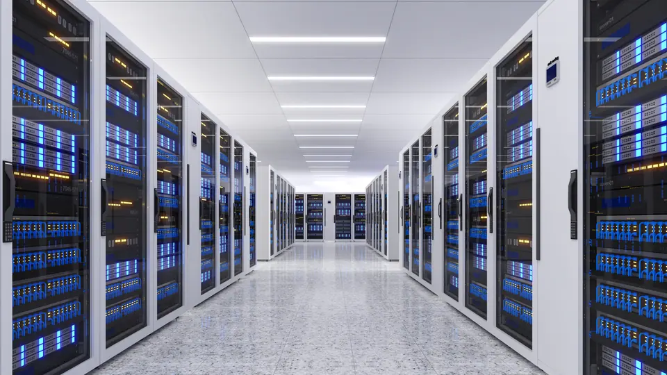 Shot of data center with multiple rows of fully operational server racks
